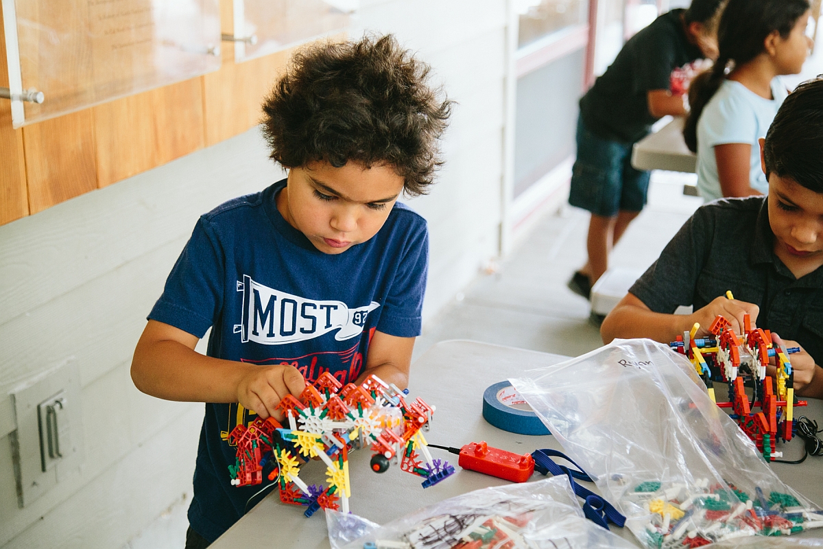 Kid Building Dino